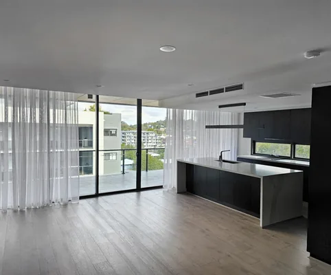 Sheer curtains in an open-plan kitchen and living area