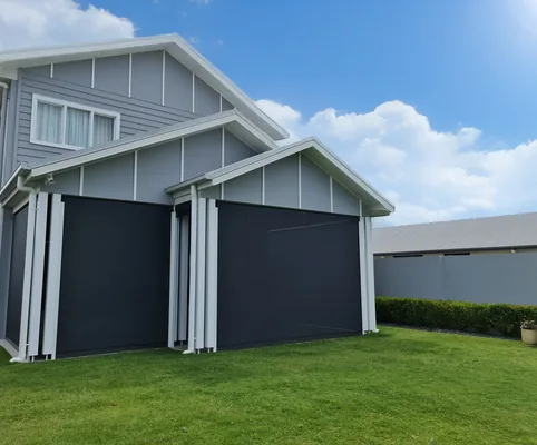 Outdoor blinds on a garage-style opening