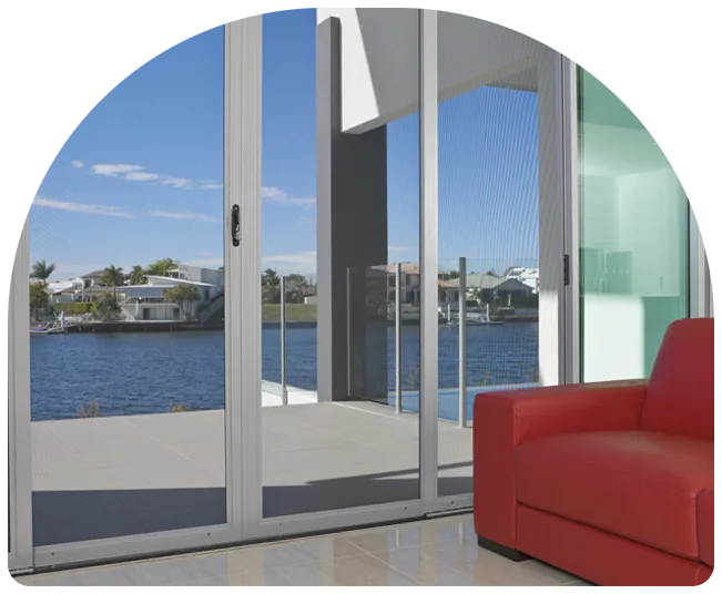 Sliding glass doors with security screens overlooking the water