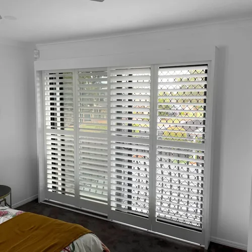 Plantation shutters on a bedroom window in Wellington Point