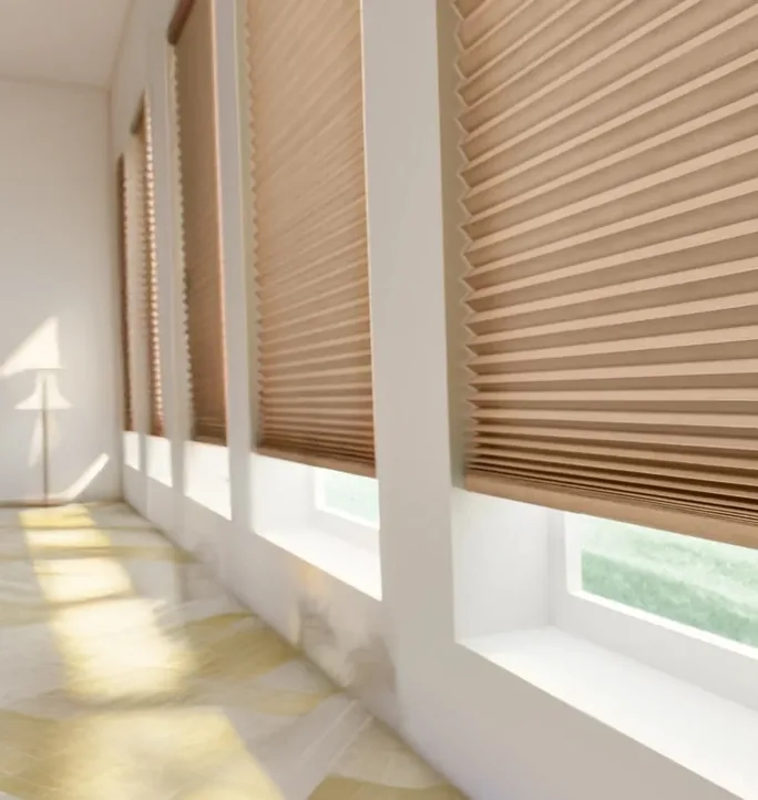 Honeycomb blinds along a row of windows