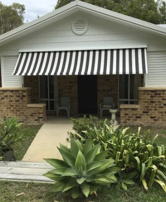 Striped fixed awning over a front porch