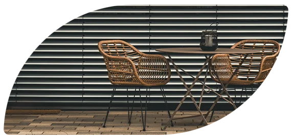 Outdoor blinds behind a cafe table and chairs