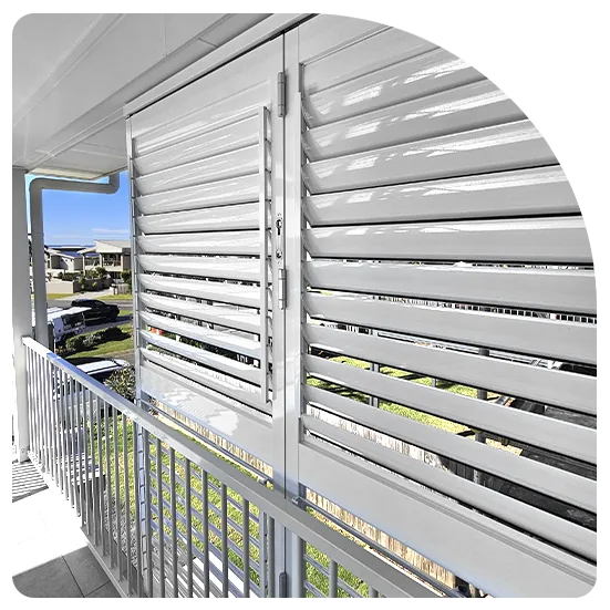 Outdoor plantation shutters on a balcony