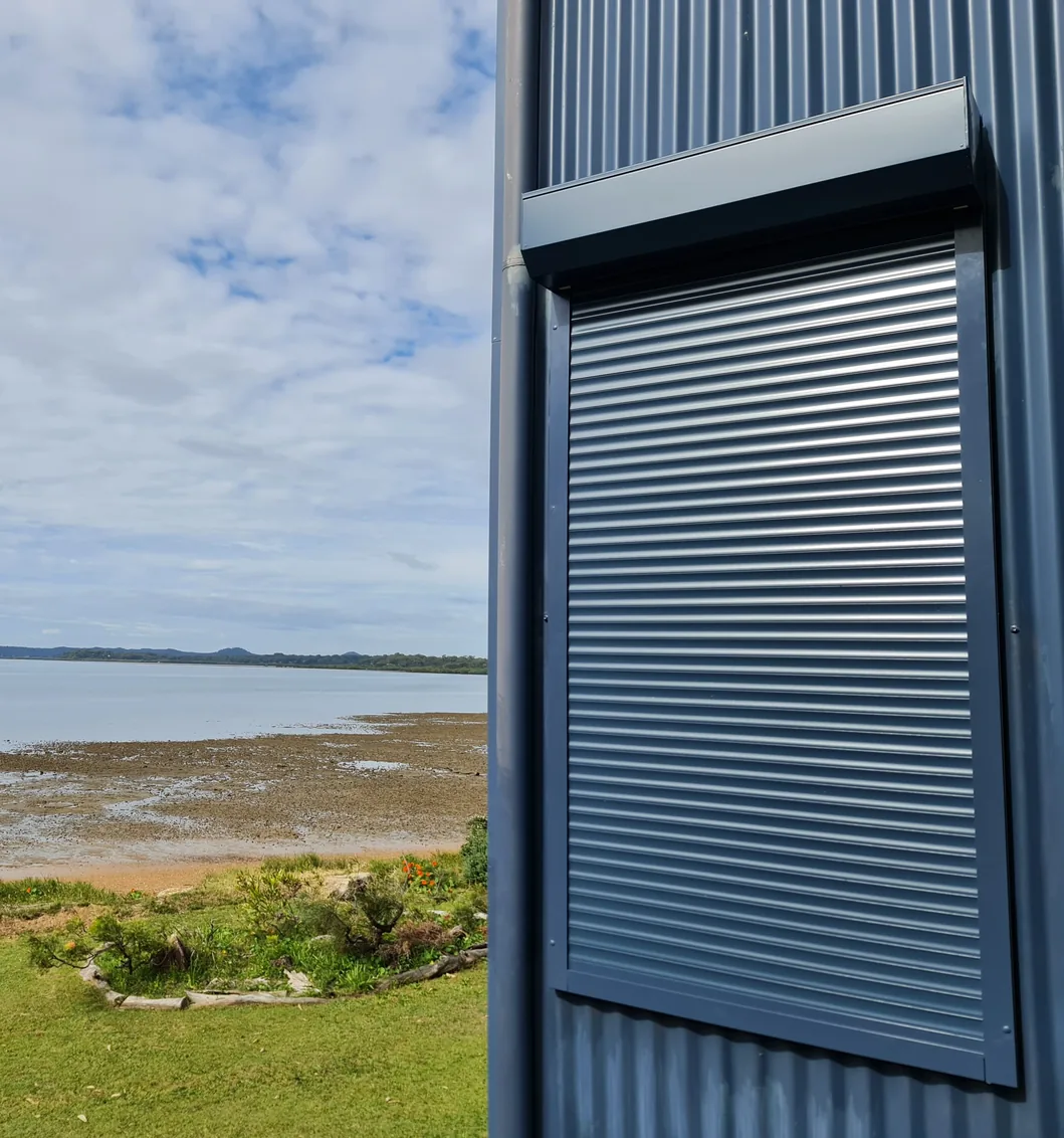 Roller shutter on a window overlooking the bay
