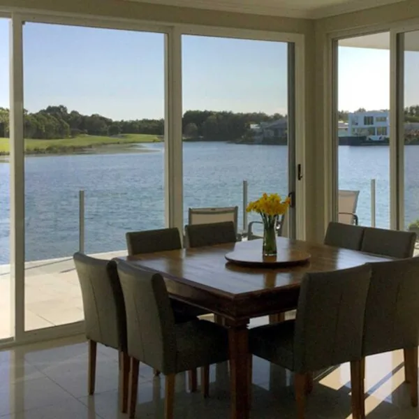 SecureView SaltWater Series screens in a waterfront dining room