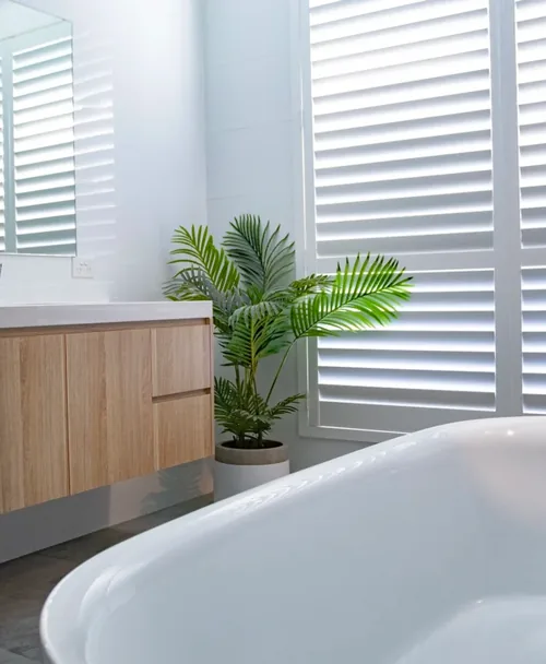 Polymer plantation shutters in a bathroom