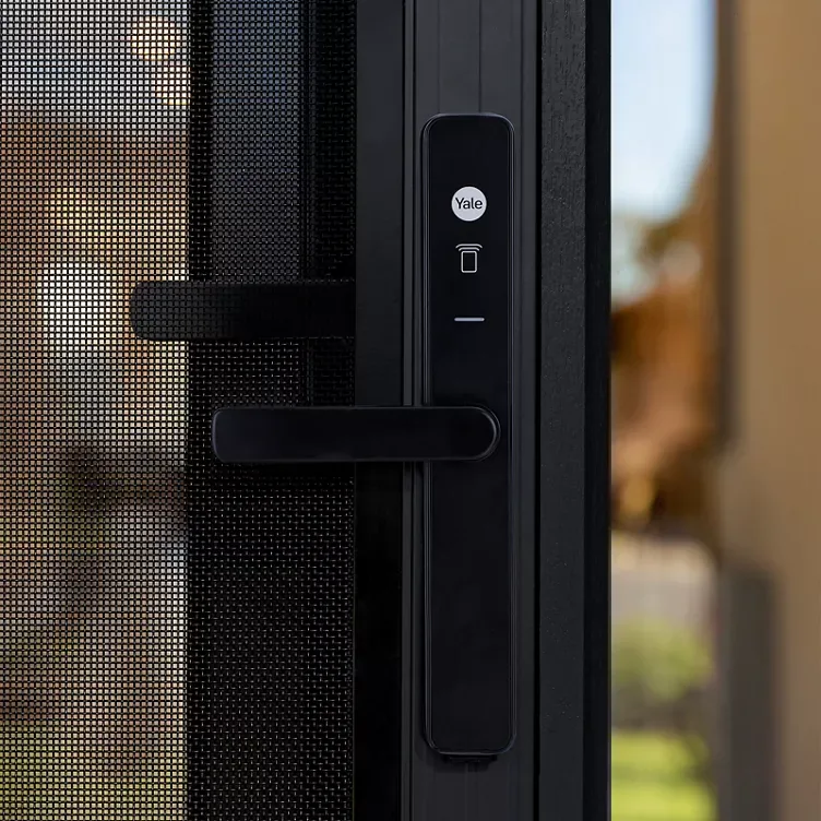 Yale smart lock on a security screen door